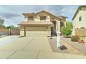 Inviting two-story home with a well-maintained yard and two car garage at 15454 W Evans Dr, Surprise, AZ 85379