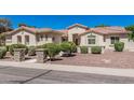 Charming single-story home featuring a tile roof, desert landscaping, and inviting curb appeal under a clear blue sky at 1834 E Scorpio Pl, Chandler, AZ 85249