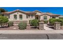 Attractive single-story home with desert landscaping, stone accents, and a welcoming entrance under a bright sky at 1834 E Scorpio Pl, Chandler, AZ 85249