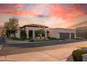 Well-manicured house with a two-car garage, terracotta roof, and charming landscaping at 2421 E Montebello Ave, Phoenix, AZ 85016