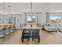 Dining room with wood table, island seating and living room combo at 24540 N 144Th Ave, Surprise, AZ 85387