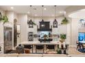 Spacious kitchen boasts a large island, custom cabinets, pendant lighting, and stainless steel appliances at 2782 E Citadel Ct, Gilbert, AZ 85298