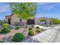 A lovely, well-maintained home, complemented by mature trees and desert landscaping, offering great curb appeal at 4027 W Copperleaf Dr, San Tan Valley, AZ 85144
