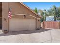 Two-car garage with attached RV parking and desert landscaping for curb appeal at 421 E Terrace Ave, Gilbert, AZ 85234