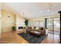 Spacious living room with fireplace, high ceilings, and natural light at 4546 E Villa Rita Dr, Phoenix, AZ 85032