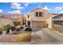 Charming home featuring a two-car garage, desert landscaping, and a neutral color palette at 7010 W Downspell Dr, Peoria, AZ 85345