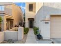 Charming home featuring a front door and desert landscaping at 7010 W Downspell Dr, Peoria, AZ 85345