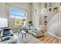 Bright living room featuring wood floors, large windows, and stylish furniture at 721 W Mountain Sky Ave, Phoenix, AZ 85045