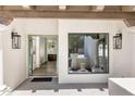 Inviting entryway featuring tiled floors, wood beam accents, and views into the home's bright interior at 7520 E Valley View Rd, Scottsdale, AZ 85250