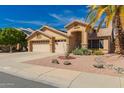 Tan single-Gathering home with a three-car garage and low-maintenance desert landscaping at 8402 W Laurel Ln, Peoria, AZ 85345