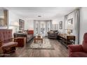 Cozy living room with hardwood floors, comfortable seating, creating a warm atmosphere at 9333 E University Dr # 113, Mesa, AZ 85207