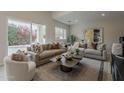 Bright and spacious living room featuring contemporary decor, comfortable seating, and lots of natural light at 9442 N 118Th St, Scottsdale, AZ 85259
