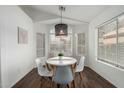 Cozy dining room featuring a modern light fixture, and views of the front yard at 1439 S Dodge St, Gilbert, AZ 85233