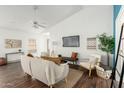 Stylish living room boasting high ceilings, a ceiling fan, and wood-look flooring at 1439 S Dodge St, Gilbert, AZ 85233