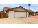 A well maintained single-story home showing the two-car garage at 16010 N 47Th Dr, Glendale, AZ 85306