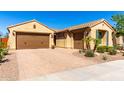 Charming single-story home with a three-car garage, tile roof, desert landscaping and paver driveway at 25862 N 108Th Ave, Peoria, AZ 85383
