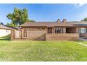 Charming single-story brick home with a well-maintained front lawn and cozy entrance at 27 W Concorda Dr # 104, Tempe, AZ 85282
