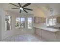 Eat-in kitchen nook with tile floors, natural light, and a view of the backyard at 2806 E Pontiac Dr, Phoenix, AZ 85050