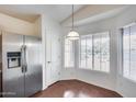 Eat-in kitchen featuring stainless steel appliances, tile flooring, and ample natural light at 30458 N Sunray Dr, San Tan Valley, AZ 85143