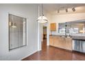 Bright and airy kitchen area with stainless steel appliances and a window overlooking the backyard at 30458 N Sunray Dr, San Tan Valley, AZ 85143