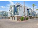Modern townhome complex with well-maintained landscaping and private garage parking at 3633 N 3Rd Ave # 2012, Phoenix, AZ 85013