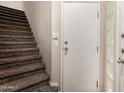 Staircase featuring plush carpet and a door leading outside to the property at 3633 N 3Rd Ave # 2012, Phoenix, AZ 85013