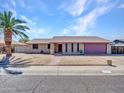 A single-story brick home with a well-kept front yard, a red brick walkway, and a charming curb appeal at 4139 W Anderson Dr, Glendale, AZ 85308
