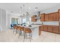 Bright, open kitchen featuring a large island with seating and stylish pendant lighting at 4247 S Zenith --, Mesa, AZ 85212