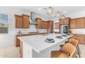 Beautiful kitchen with large island, quartz countertops, and stainless steel appliances at 4247 S Zenith --, Mesa, AZ 85212