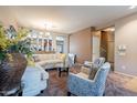 Spacious living area featuring stylish furniture, neutral tones, and a seamless flow to the dining area at 5139 W Shumway Farm Rd, Laveen, AZ 85339