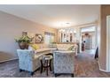 Inviting living room with cozy seating, plush carpet, and neutral décor at 5139 W Shumway Farm Rd, Laveen, AZ 85339