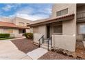 Exterior view of townhome featuring desert landscaping, private entrance, and red tile roof at 520 N Stapley Dr # 123, Mesa, AZ 85203