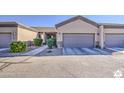 The exterior showcases the house's front facade, 2-car garage and desert landscaping on a sunny day at 846 N Pueblo Dr # 119, Casa Grande, AZ 85122