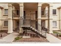 Apartment building exterior with staircases leading to upper floors, and shaded outdoor seating at 925 S Longmore -- # 210, Mesa, AZ 85202