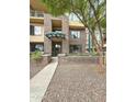 Inviting multi-story brick condo building with manicured landscaping and shaded entryway at 16 W Encanto Blvd # 2, Phoenix, AZ 85003