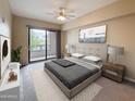 A main bedroom offers a king bed, fan, balcony access, and carpeted floors at 16 W Encanto Blvd # 2, Phoenix, AZ 85003