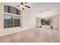 Bright living room with tile floors, vaulted ceilings, and large windows offering plenty of natural light at 714 W Mesquite St, Gilbert, AZ 85233