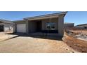 A single Gathering home in a new development with a garage and covered entryway, showing clear sky at 11429 E Utah Ave, Mesa, AZ 85212