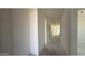 Bright hallway with smooth, freshly painted white walls in a new construction home awaiting final touches at 11429 E Utah Ave, Mesa, AZ 85212
