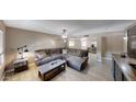 Cozy living room featuring a plush sectional sofa and ample natural light at 2222 W Kristal Way, Phoenix, AZ 85027