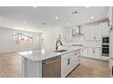 Well-equipped kitchen with stainless steel appliances, a large island, and ample cabinet space in a modern design at 23724 N 165Th Dr, Surprise, AZ 85387