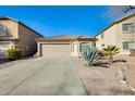 Charming single-story home featuring a two-car garage, desert landscaping, and a neutral color palette at 4056 E Rock Dr, San Tan Valley, AZ 85143