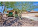 Charming home exterior featuring manicured landscaping, a garage, and inviting curb appeal at 5424 S 15Th St, Phoenix, AZ 85040