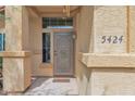 Inviting front door with security screen and covered porch at 5424 S 15Th St, Phoenix, AZ 85040