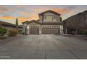 Beautiful two-story home featuring a spacious three-car garage and well-maintained landscaping at 8246 W Melinda Ln, Peoria, AZ 85382
