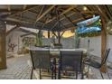 Outdoor kitchen and bar area featuring a grill, lighting, a fan, and a TV at 8246 W Melinda Ln, Peoria, AZ 85382