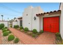 Inviting front entrance with a red door and a brick walkway at 740 W Mountain View Dr, Mesa, AZ 85201
