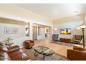 Bright living room with hardwood floors, neutral walls, and elegant furnishings at 7723 E Visao Dr, Scottsdale, AZ 85266