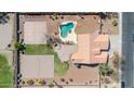 Complete aerial view of property featuring a pool, volleyball court, basketball court, lush landscaping and a private backyard oasis at 1289 E Palo Blanco Way, Gilbert, AZ 85296