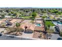Spacious property with a pool, volleyball court, basketball court, lush landscaping and a private backyard oasis at 1289 E Palo Blanco Way, Gilbert, AZ 85296